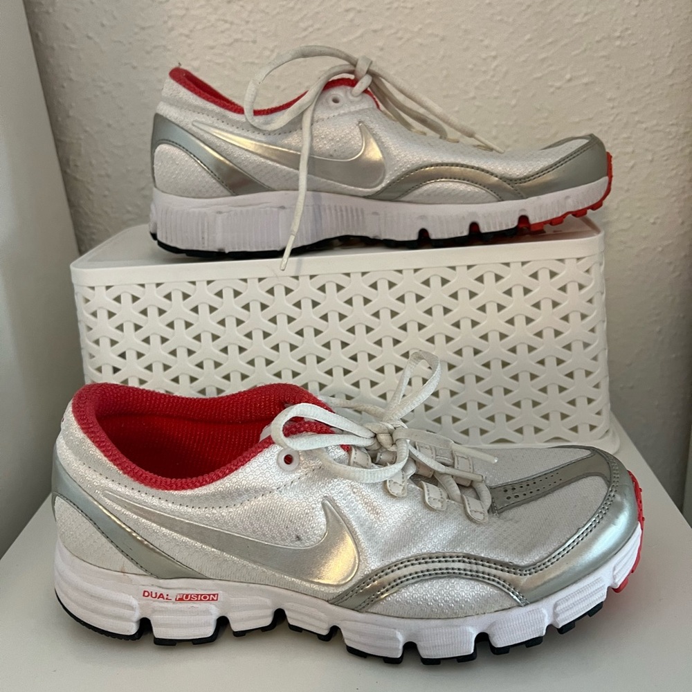 Nike tennis shoes. Orange and white with silver accents. Sz 8.5